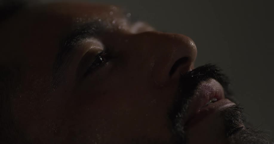Portrait of a bearded man with a sweaty face