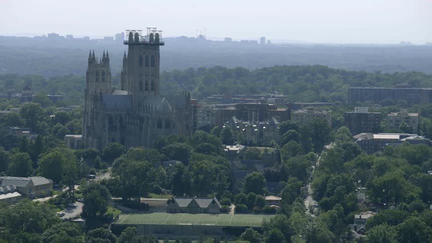 Trees and buildings stand in the distance