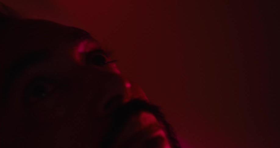 The sick man is sweating under the red light