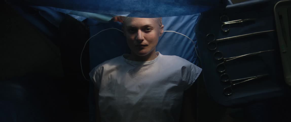 A footage of a lady on a surgery bed