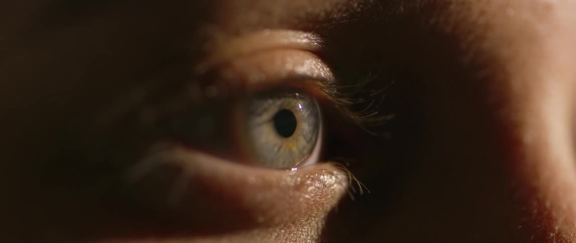 A person blinks their eye