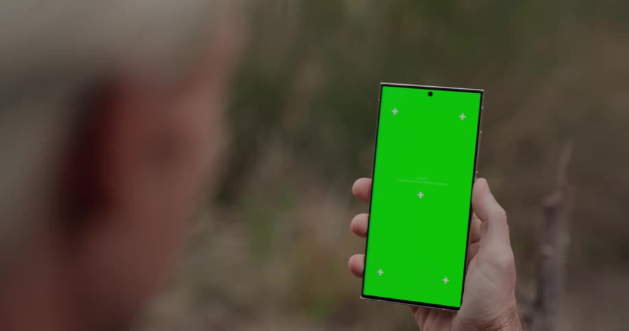 Persons hand interacting with a smartphone