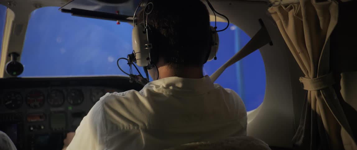 Airplane pilot flying a plane through turbulence