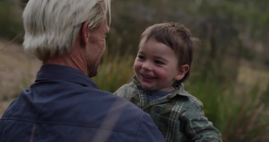 Father and son hugging outdoors
