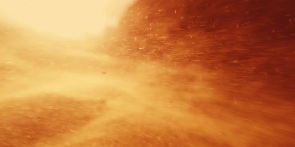 Fire and embers scorch past the camera inside the inferno