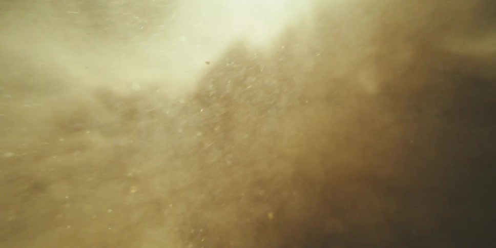 Warm Dust Clouds Parting to Reveal Deeper Layers Beyond