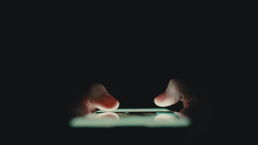 A person scrolls through social media on their phone