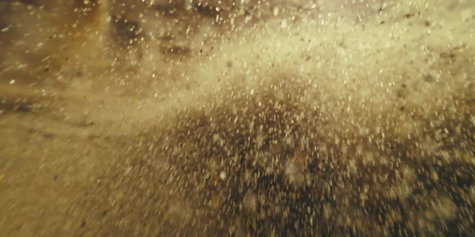 Free Falling Through Cosmic Particles Before Settling Into Fluid Motion