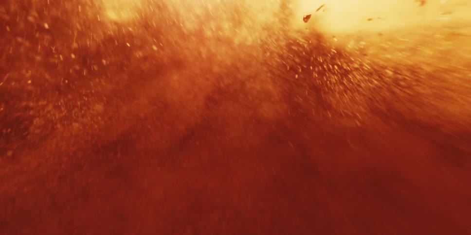 Blinding light shines through the molten magma and flame flying through the air by a cataclysm