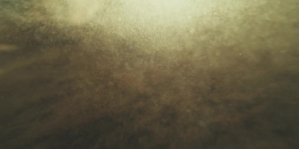 The sand blows by under the sun