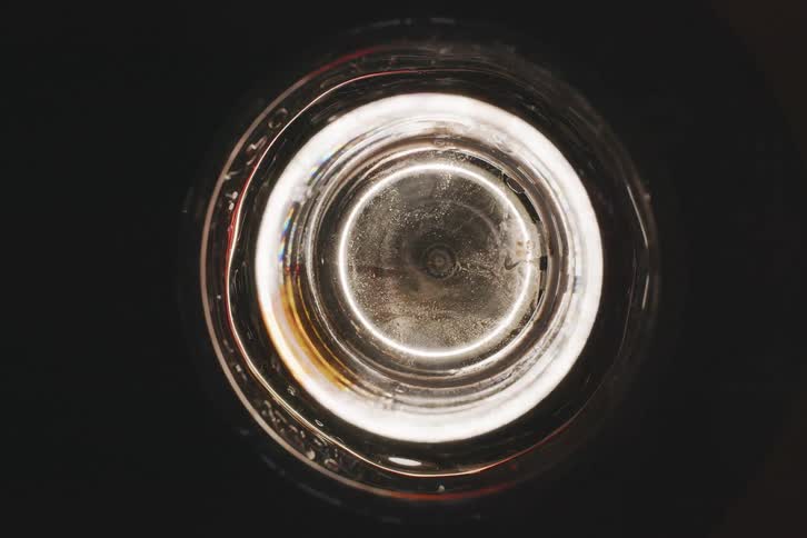 A circular object of brown color with whitish in the center that is spinning