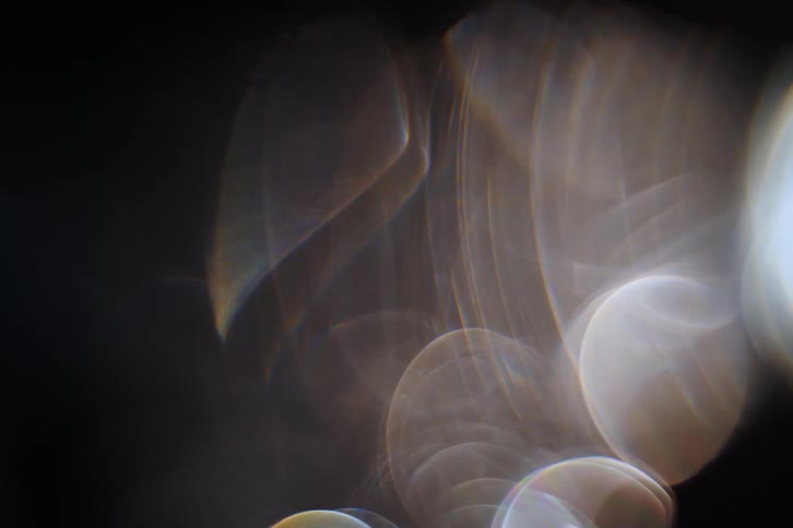 Some flashes of lights are moving quickly in a black environment
