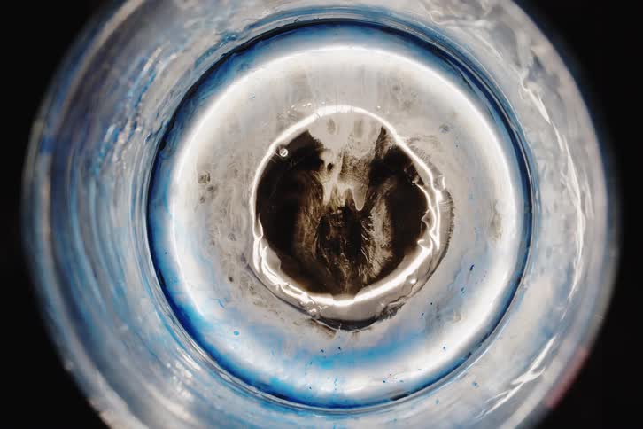 Abstract liquid body against a dark background