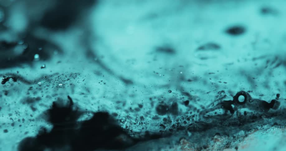 Dense and abstract liquid in transparent color in motion