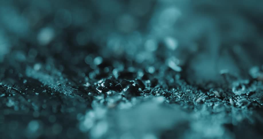 Abstract surface in black and blue color with a liquid