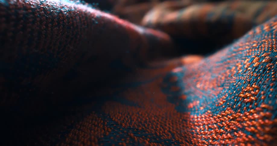 Close up and abstract on a red and blue colored fabric