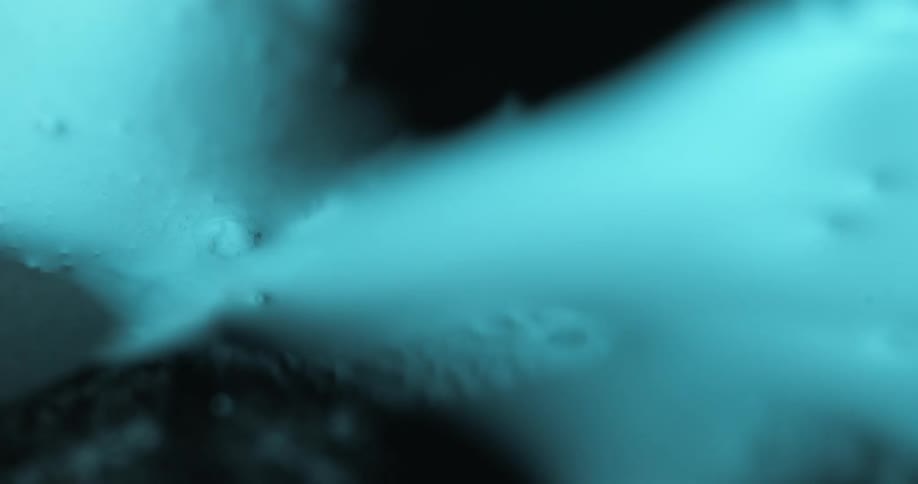 Abstract whitish liquid in motion