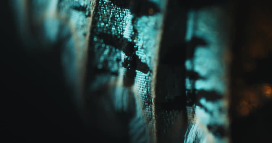 The embroidered fabric is laying in the dark