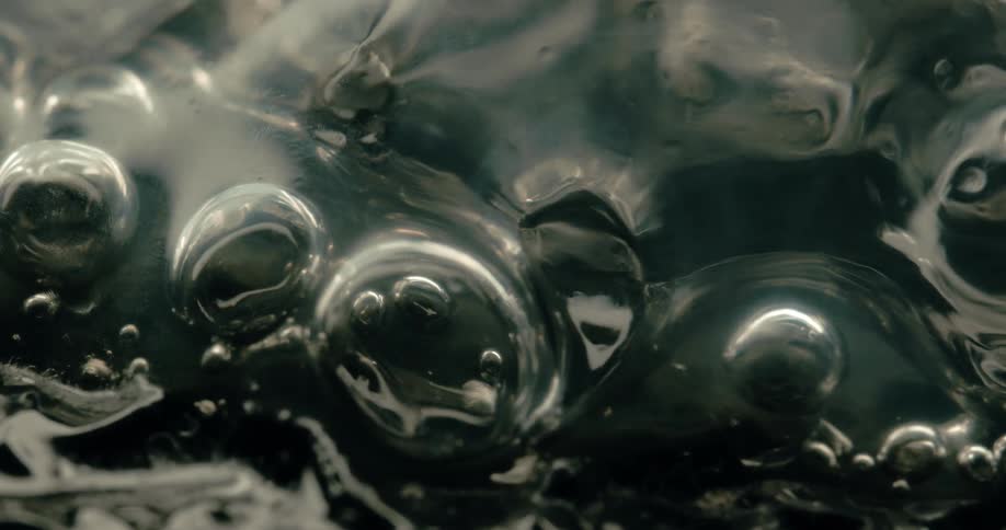Bubbles form and collapse on the surface of a hot liquid