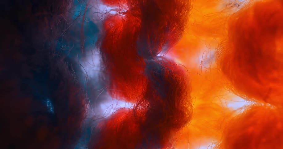 Blue and orange yarns form a knit fabric with small holes