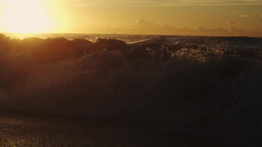 Ocean waves breaking at the shore on a sunny morning