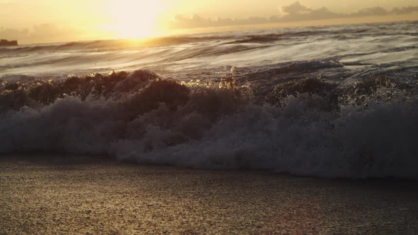 Ocean wave breaking on beach area