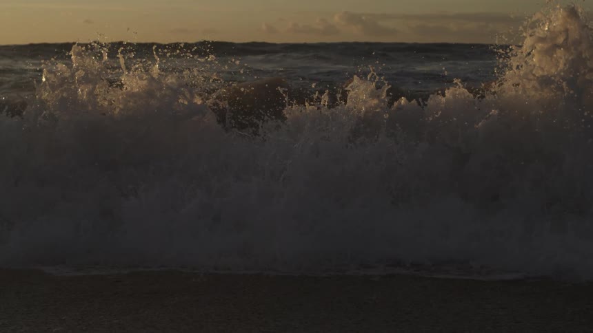 Slow motion of large wave crashing on the shoreline