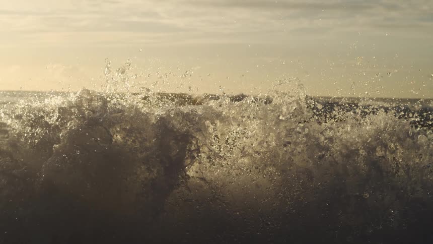 A sea with strong waves under sunlight