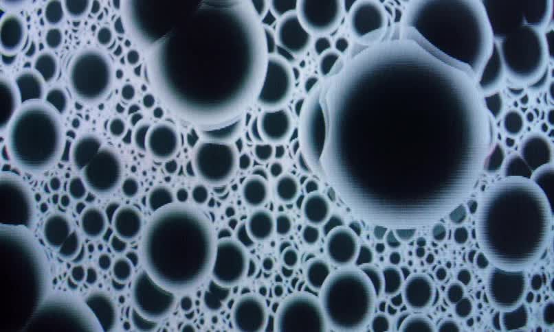Cluster of black dots in circles in abstract motion