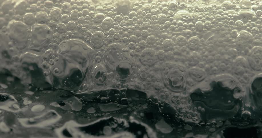The liquid is foaming with bubbles