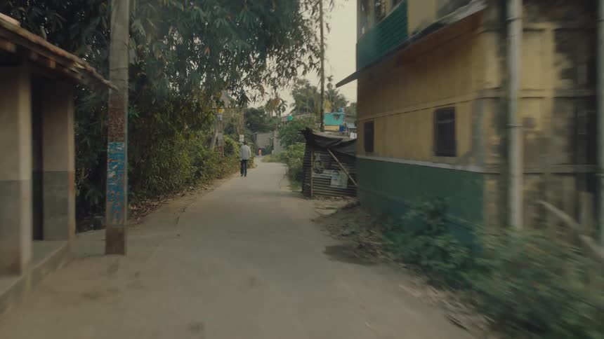 A rural village is shown with one main road going through town