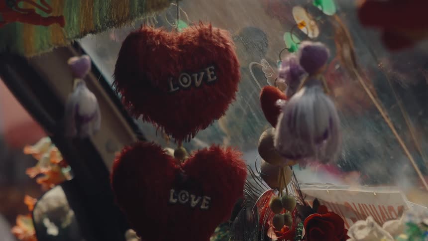 A fuzzy heart hangs outside