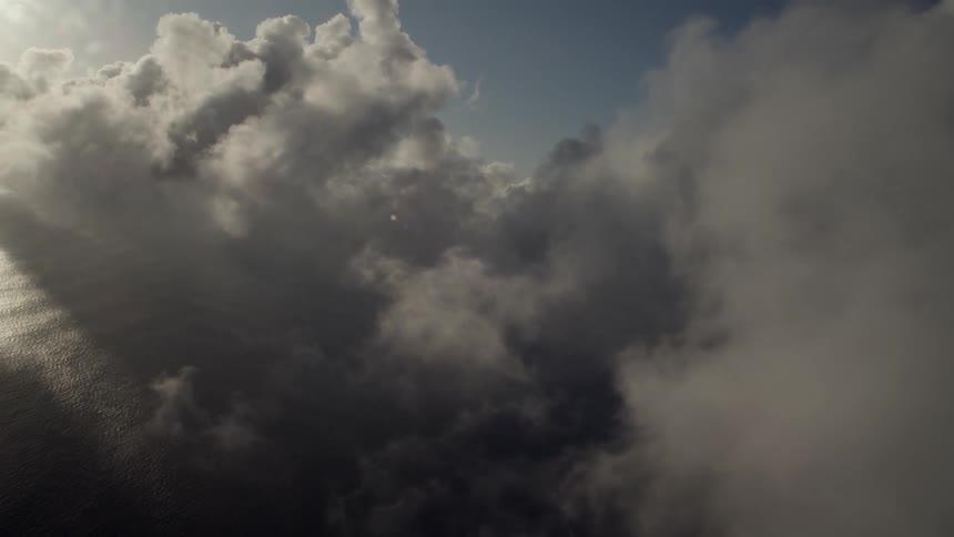 Sunlight shines through clouds in the sky