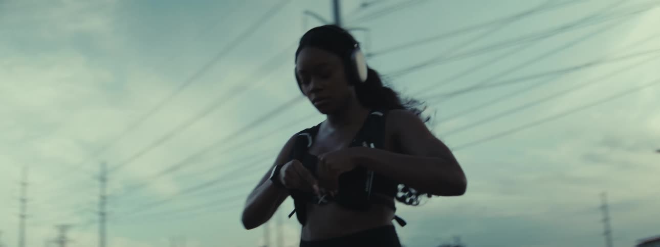 A woman is stretching before a run outside