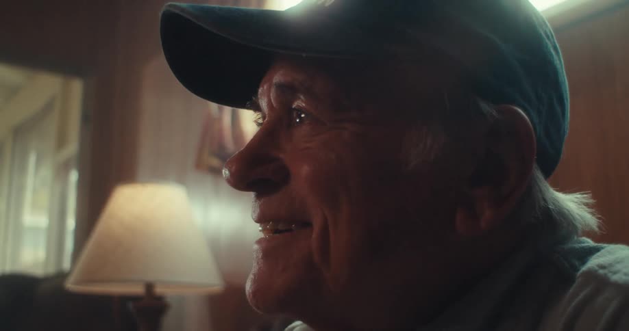 Smiling elderly man in cap