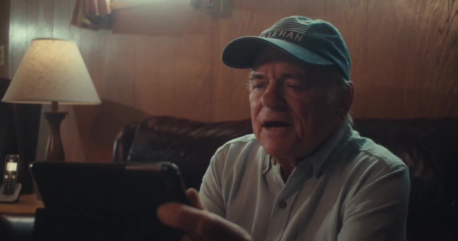 A man is talking to his tablet