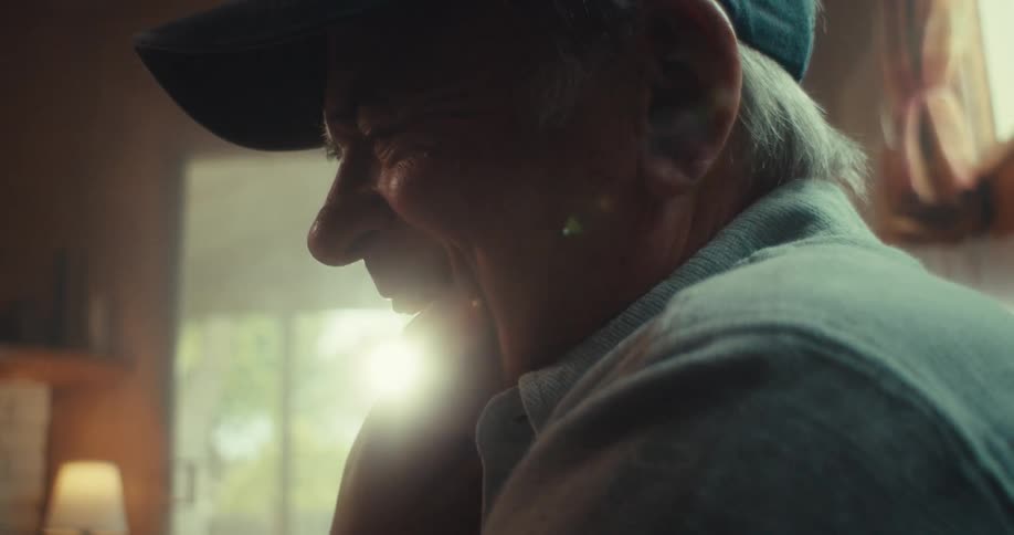 Elderly man having fun and interacting with tablet