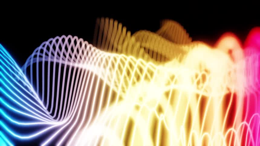 Lines of light colored in blue yellow and red form wavy patterns on a black background