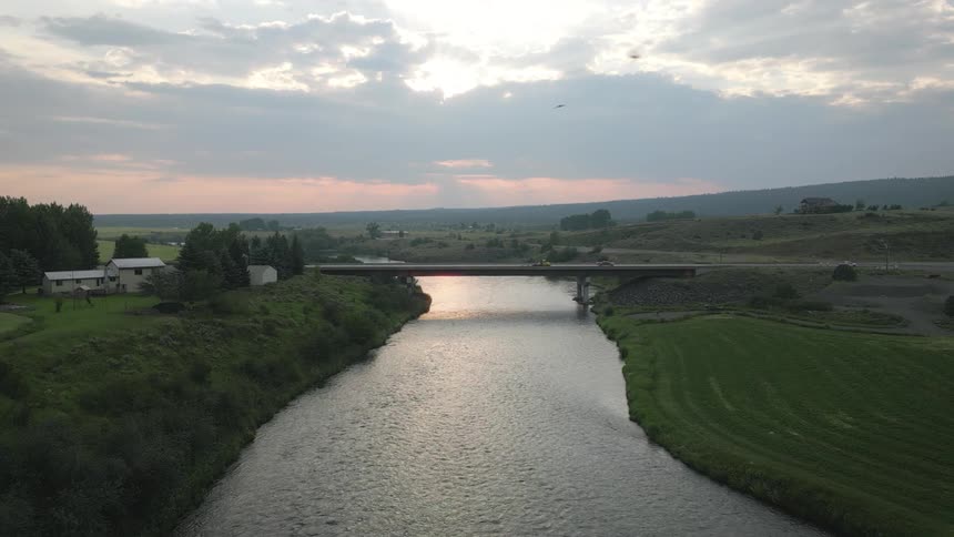A river running under a bridge below