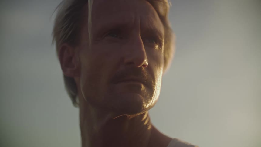 Portrait of a blond man with a beard outdoors