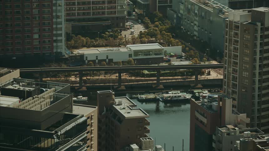 Boats in a sea canal surrounded by buildings of a metropolis