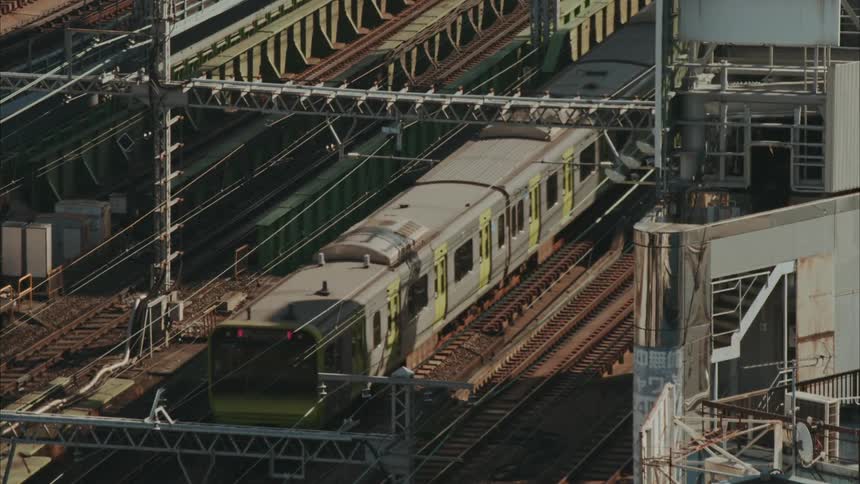 Train moves along rail track in daytime