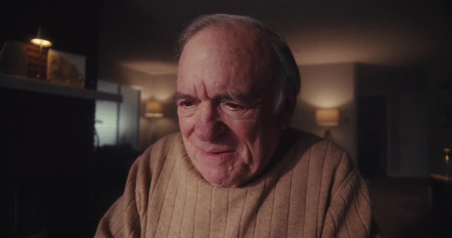 Happy elderly man laughing out loud