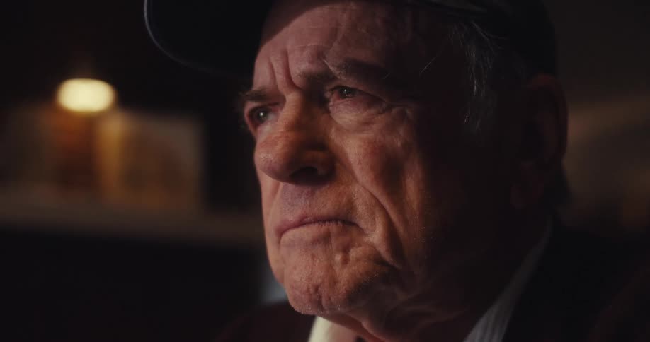 Portrait of an elderly man in a cap looking thoughtful