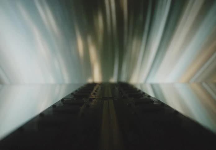 A row of ram memory sticks neatly arranged with light streaks creating a dynamic and abstract background