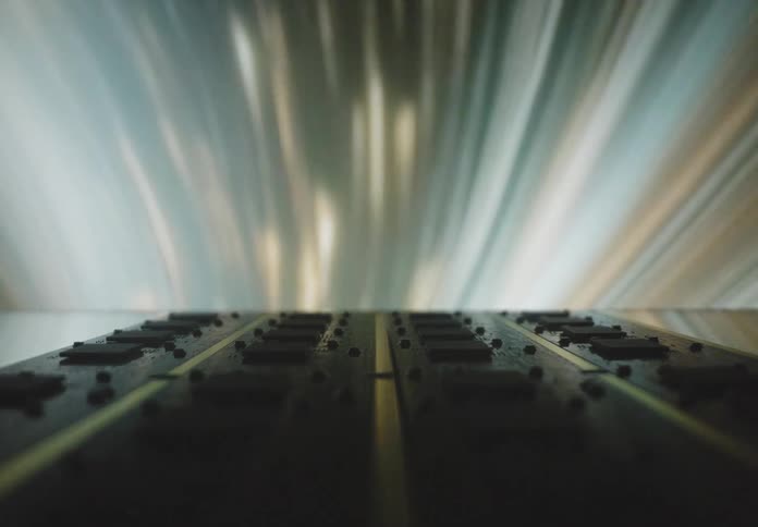 A closeup view of a circuit board with light streaks in the background creating a dynamic and futuristic atmosphere