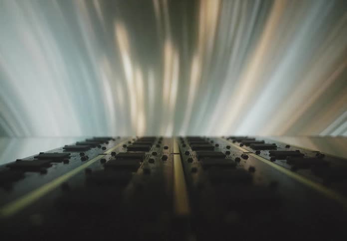 A closeup view of a circuit board with light streaks in the background creating a dynamic and futuristic atmosphere
