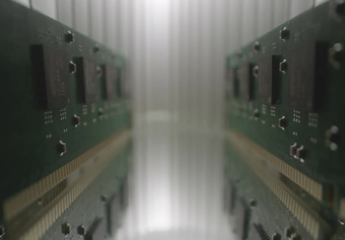 Ram memory sticks are positioned parallel to each other on a reflective surface creating an optical tunnel effect