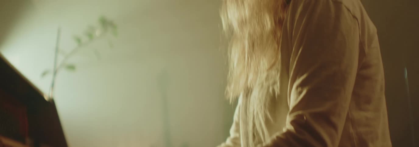 Woman sitting playing piano