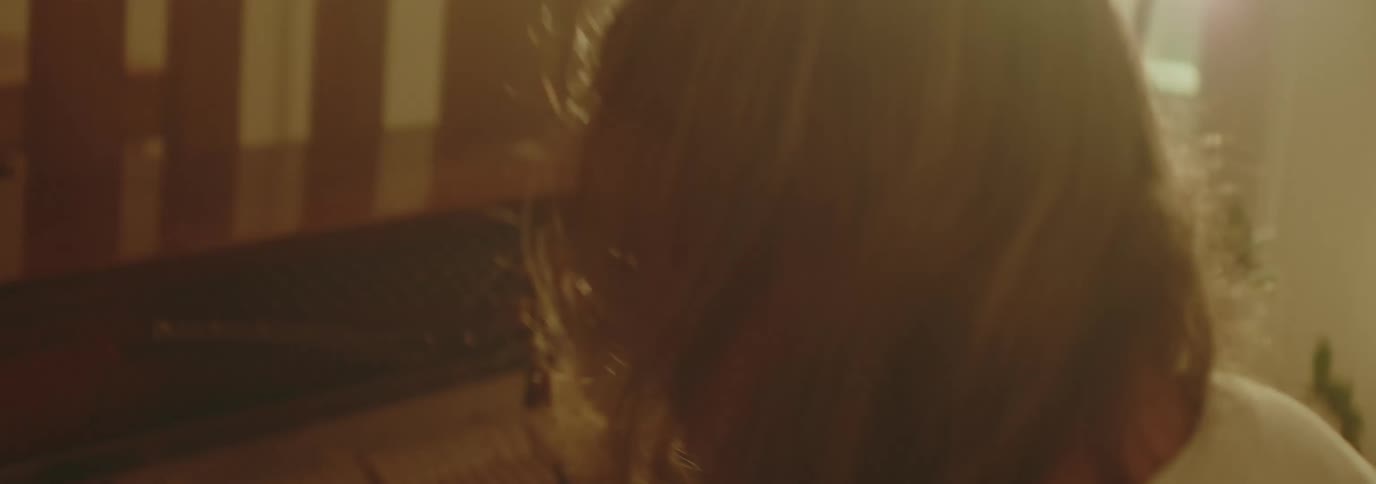 Woman moving her head while playing the piano